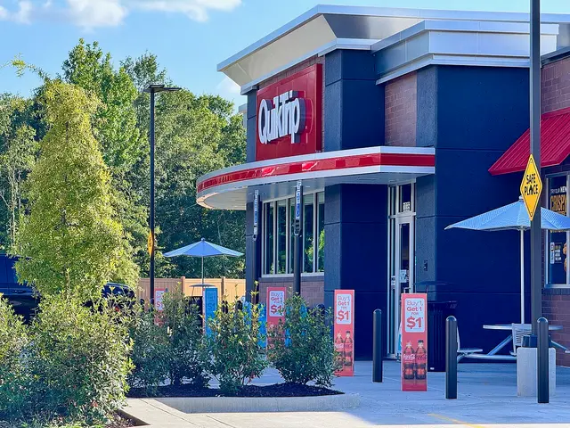 Exterior of a QuikTrip convenience store and attached gas station canopy in Watkinsville, Georgia.