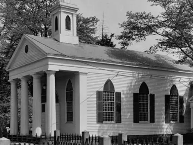 Historic black-and-white photograph of St. James Episcopal Church in Piscatawaytown, New Jersey, a white wooden church with a columned portico and spire, behind an iron fence.