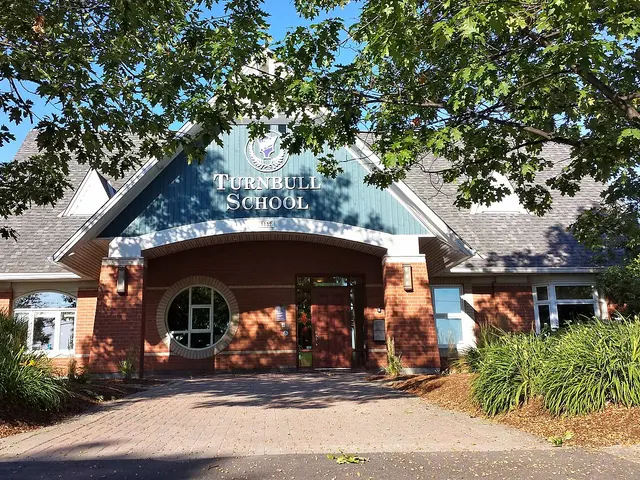 The entrance of Turnbull School in Ottawa, a brick elementary school with the school's name above the door