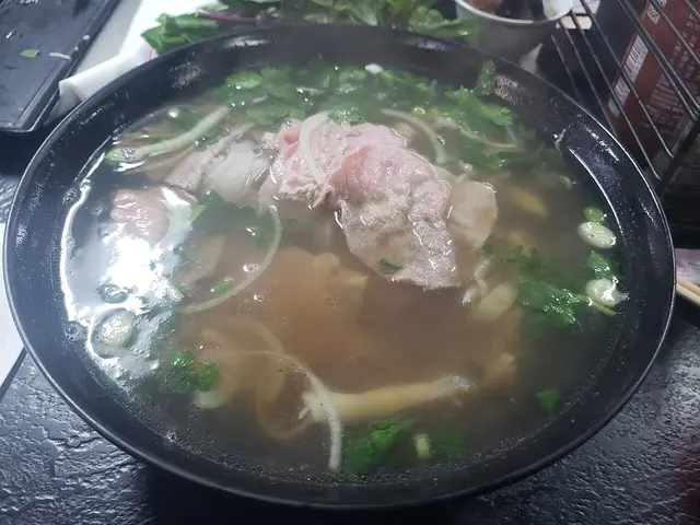 A bowl of Vietnamese pho xe lua served at a pho restaurant.
