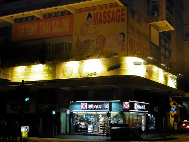 A brightly lit Circle K convenience store storefront at night with its red and white signage