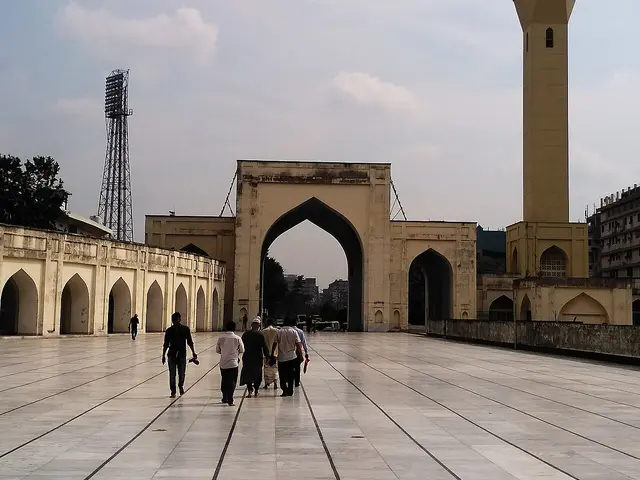 The eastern gate and minaret of a mosque courtyard