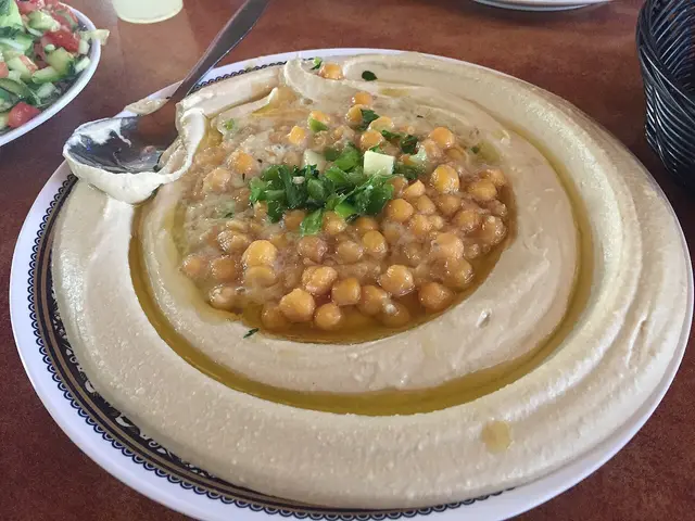 A plate of hummus served as a main dish.
